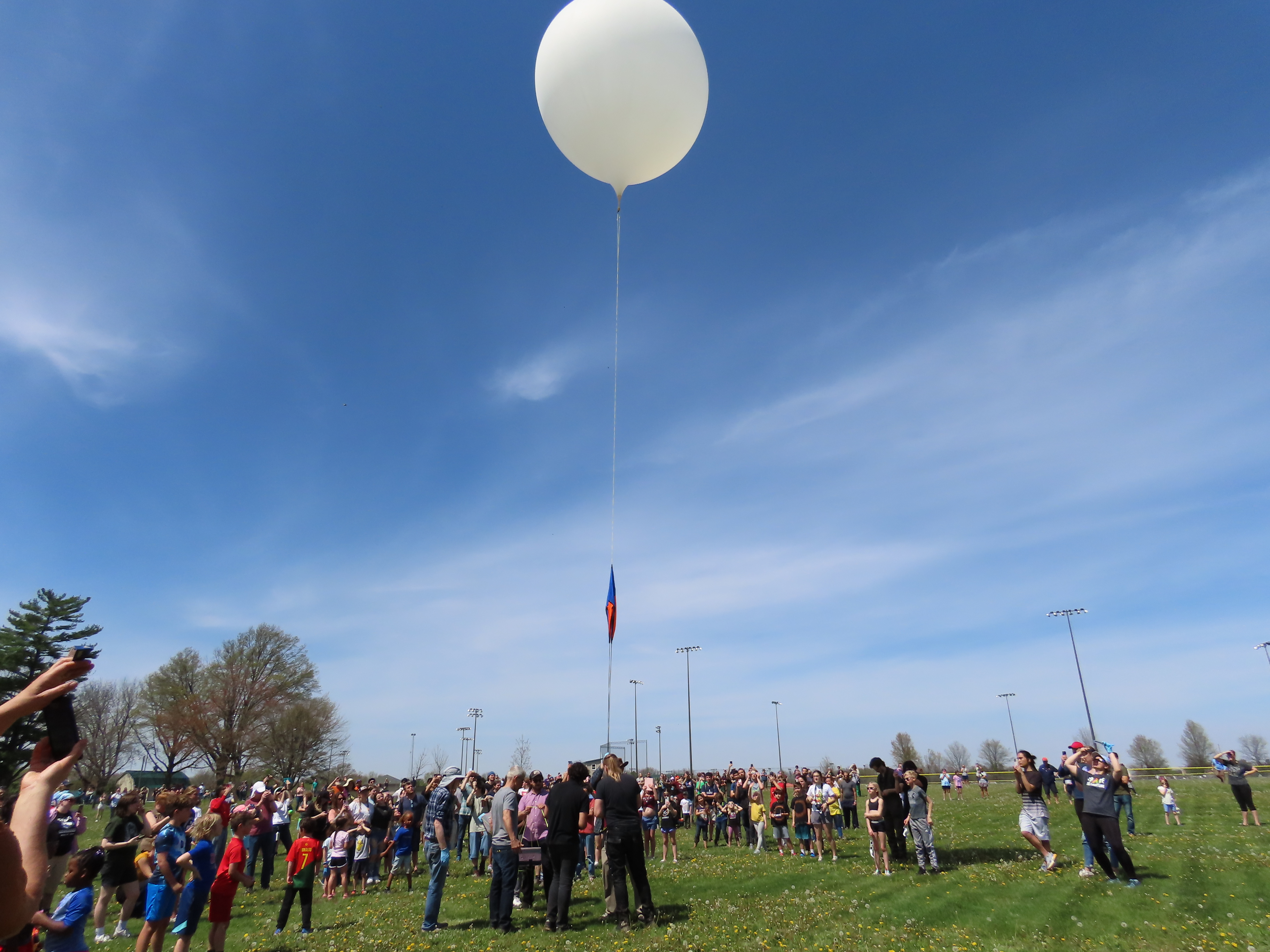 Crowd gathering to view balloon.